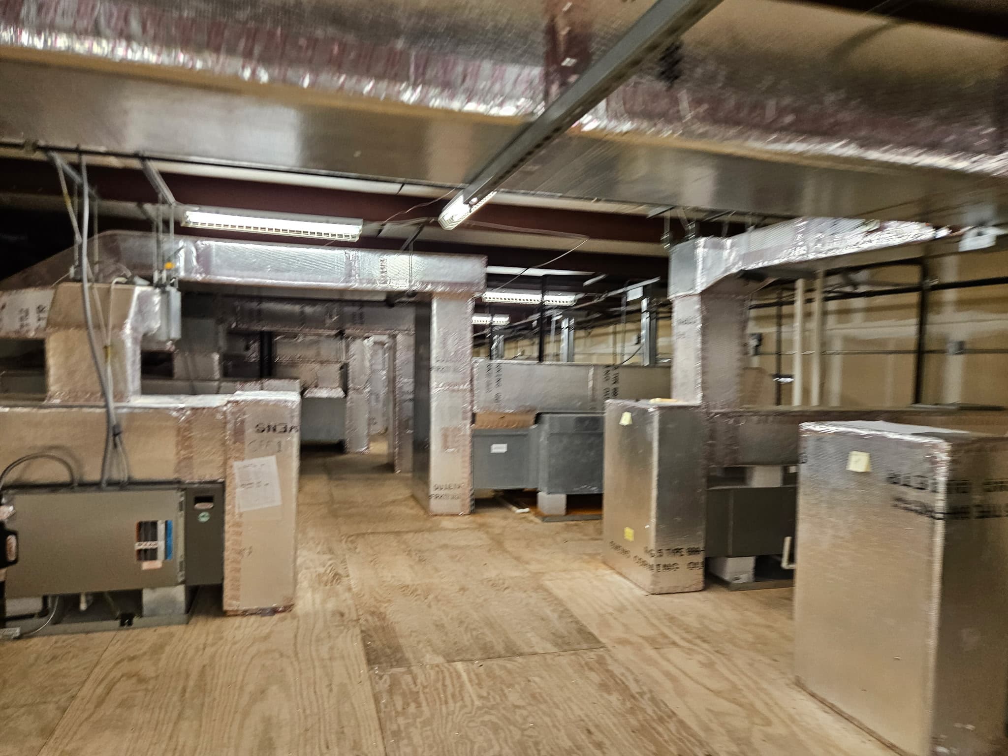 Large commercial HVAC install with multiple units and insulated ductwork